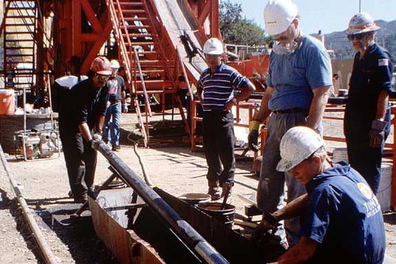 Workers at TG Drill Rig